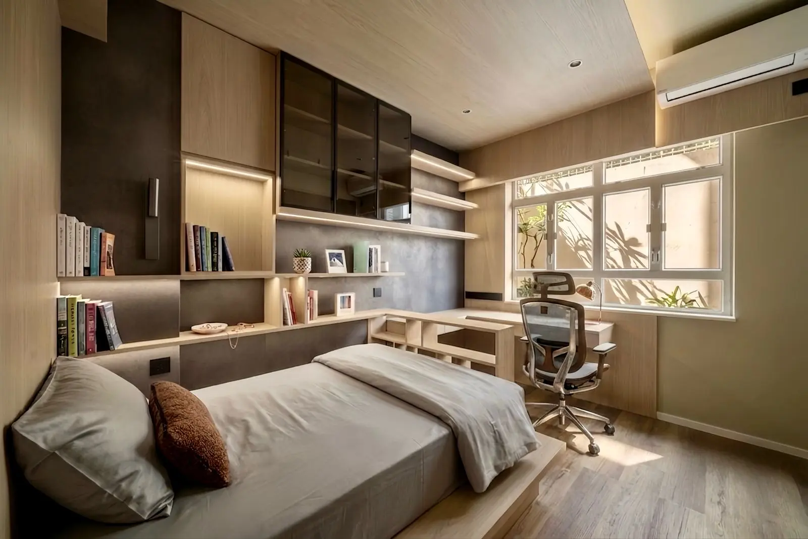 Bedroom with integrated bed, desk and library shelving