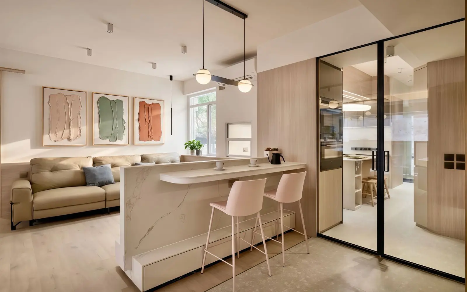 Entrance with a marble-fronted counter and glazed kitchen enclosure