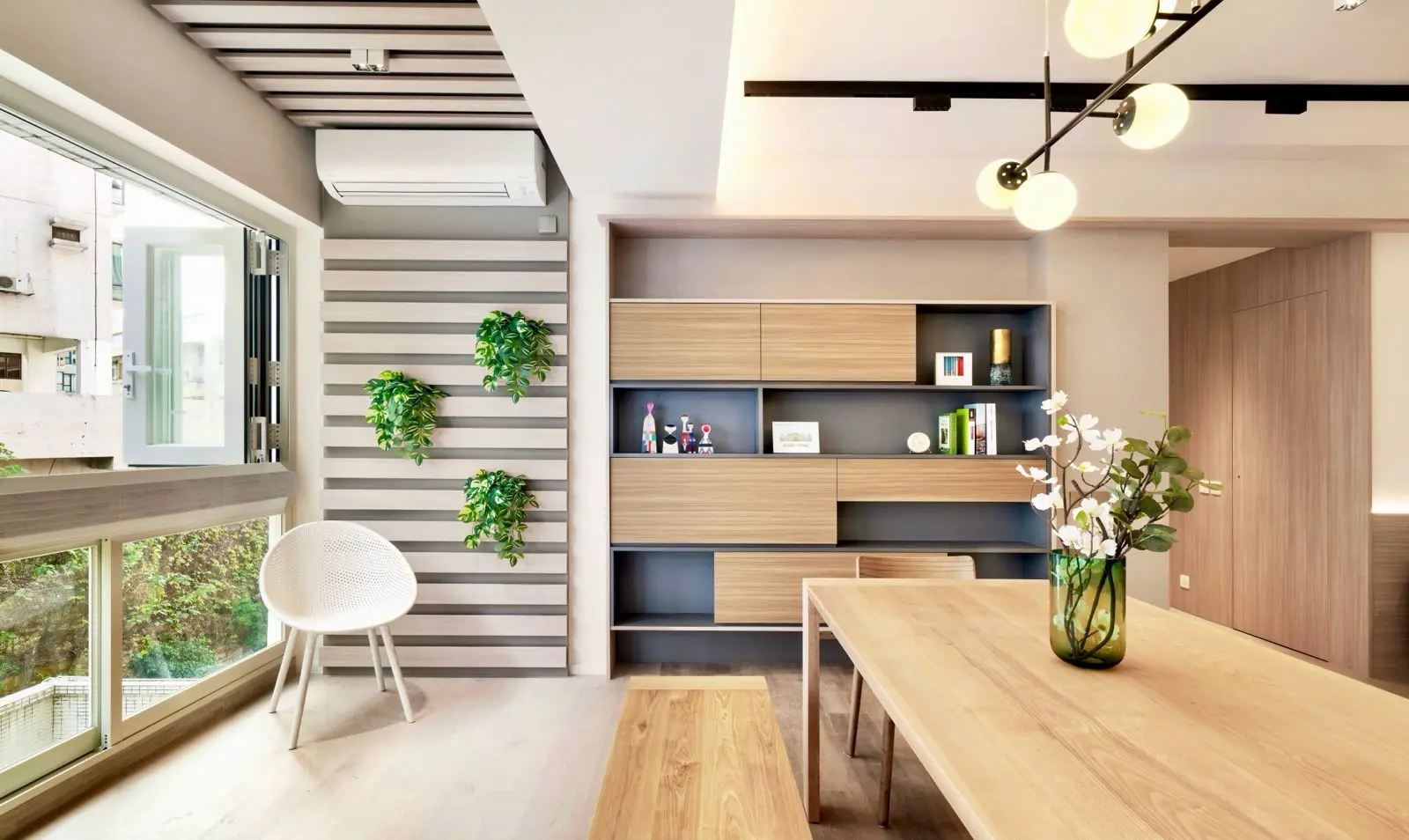 Dining area opening towards wide folding windows