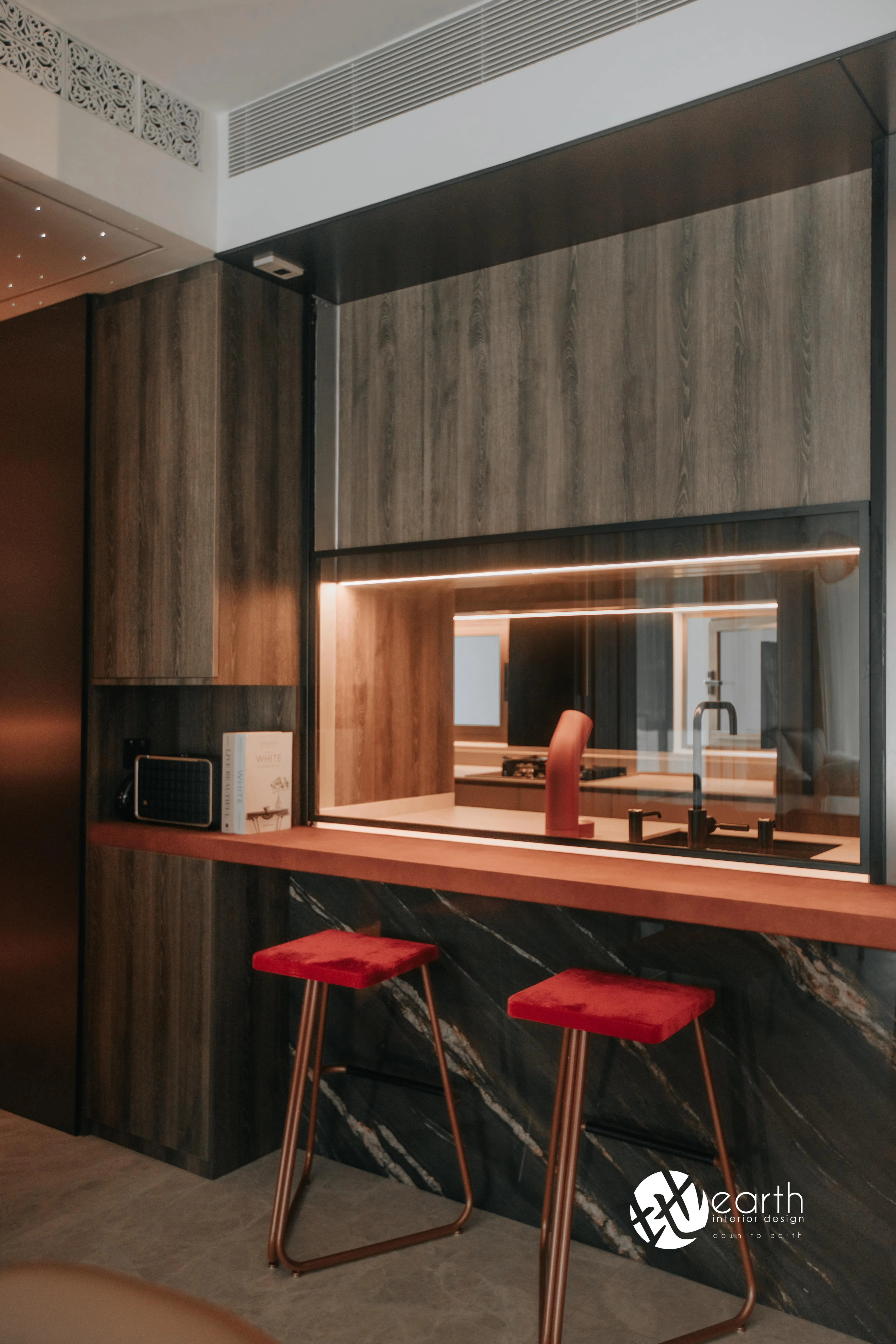 Kitchen breakfast counter with warm timber detailing at Harbour Lux