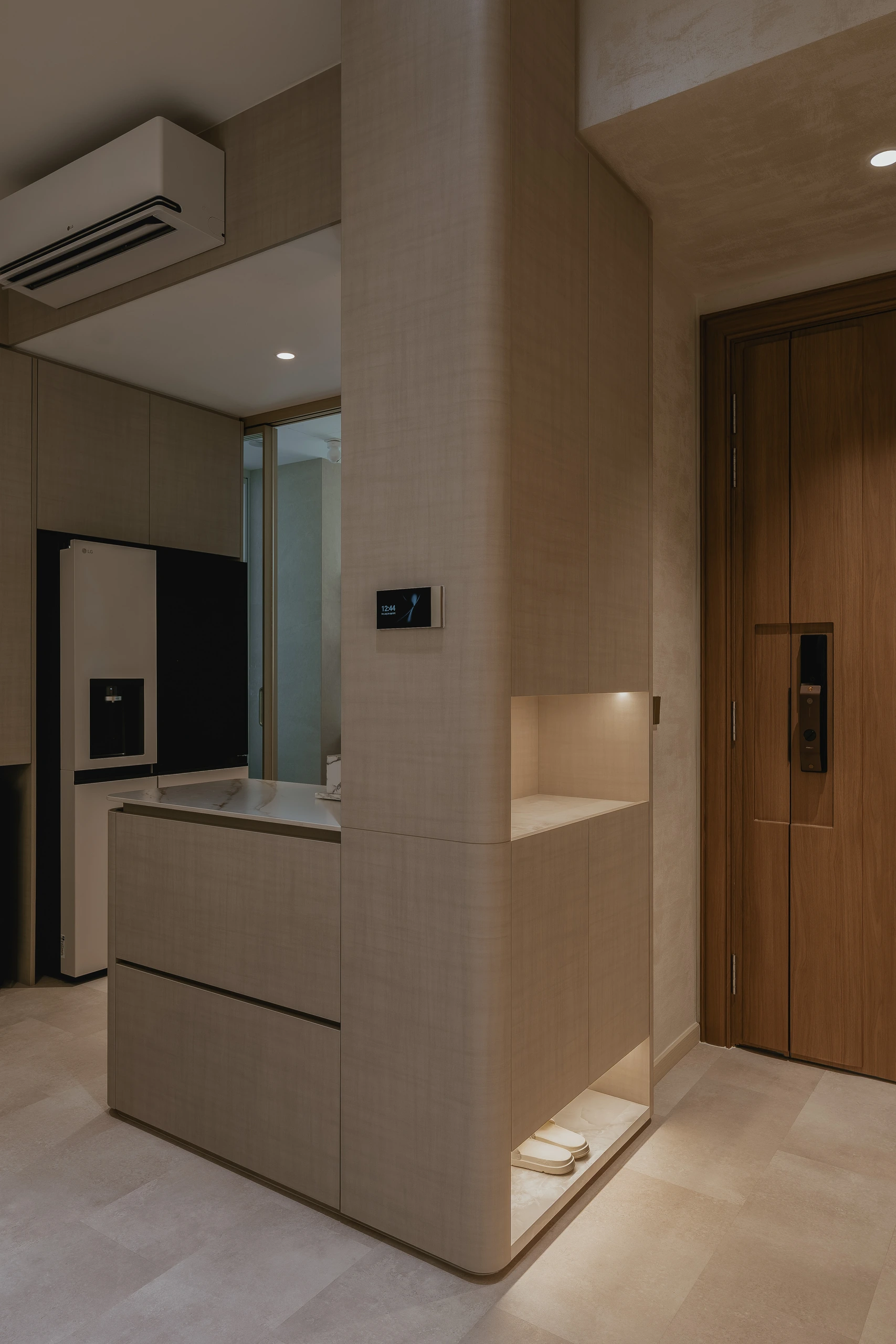 Entrance console with integrated smart-home control by Edgeline Planners
