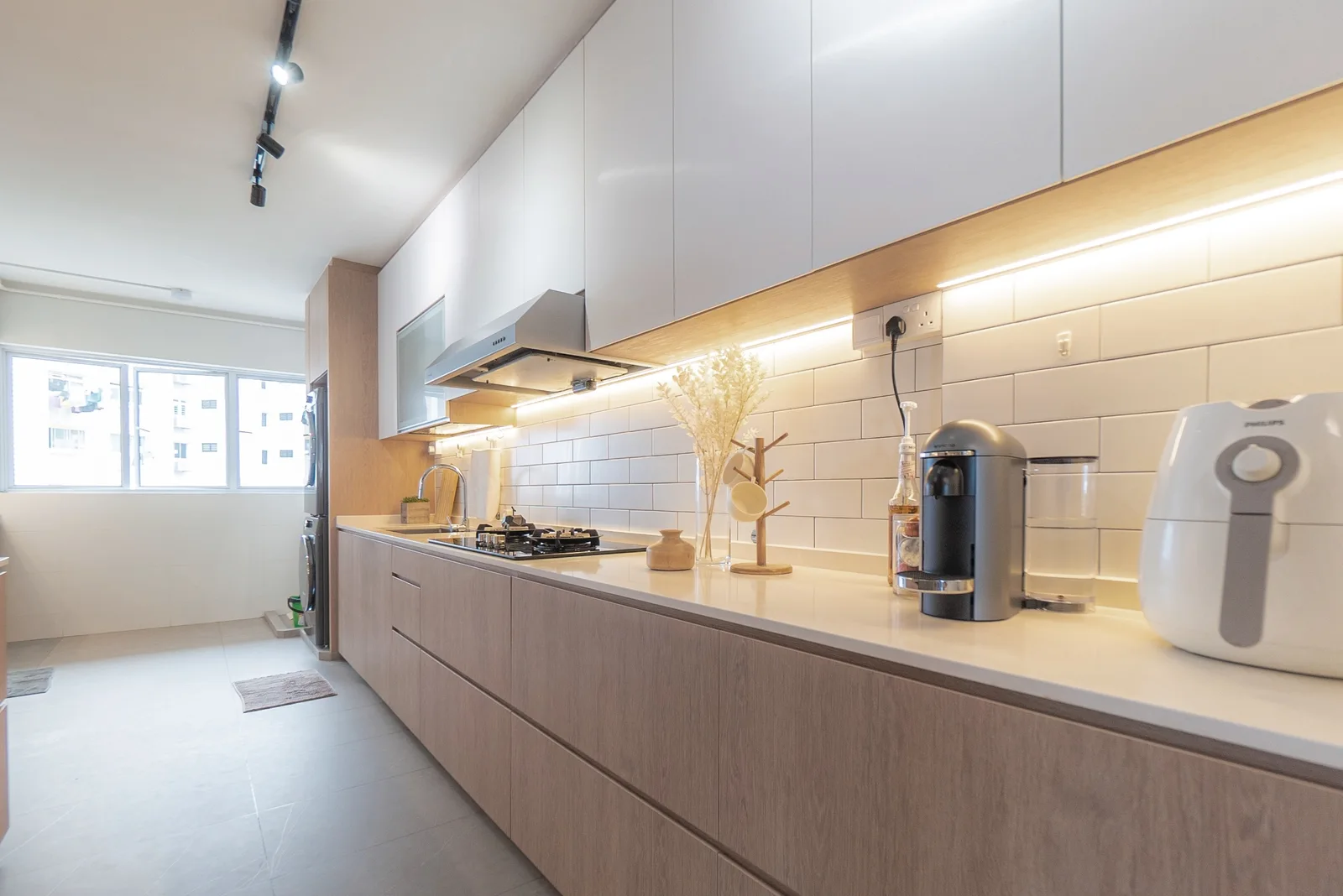 J Concept Designers &mdash; kitchen with subway tile splashback, veneer lower cabinets and white upper cabinets
