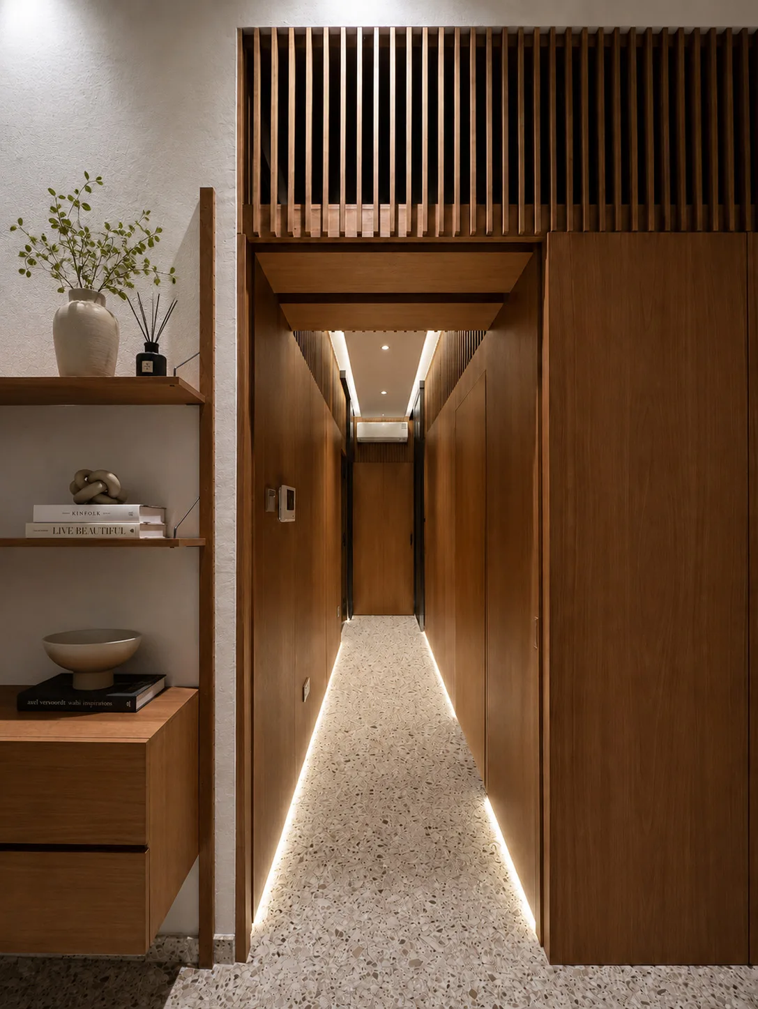 J Concept Designers &mdash; walnut corridor with trellis cat tunnel above and integrated floor-level lighting