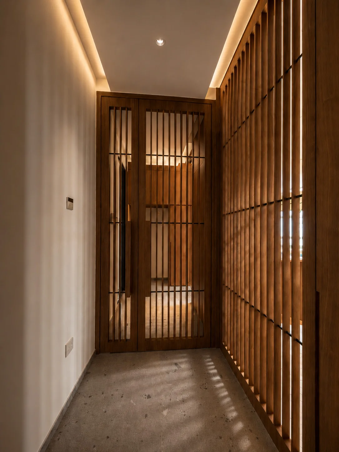 J Concept Designers &mdash; trellis entrance with concealed door and marble flooring