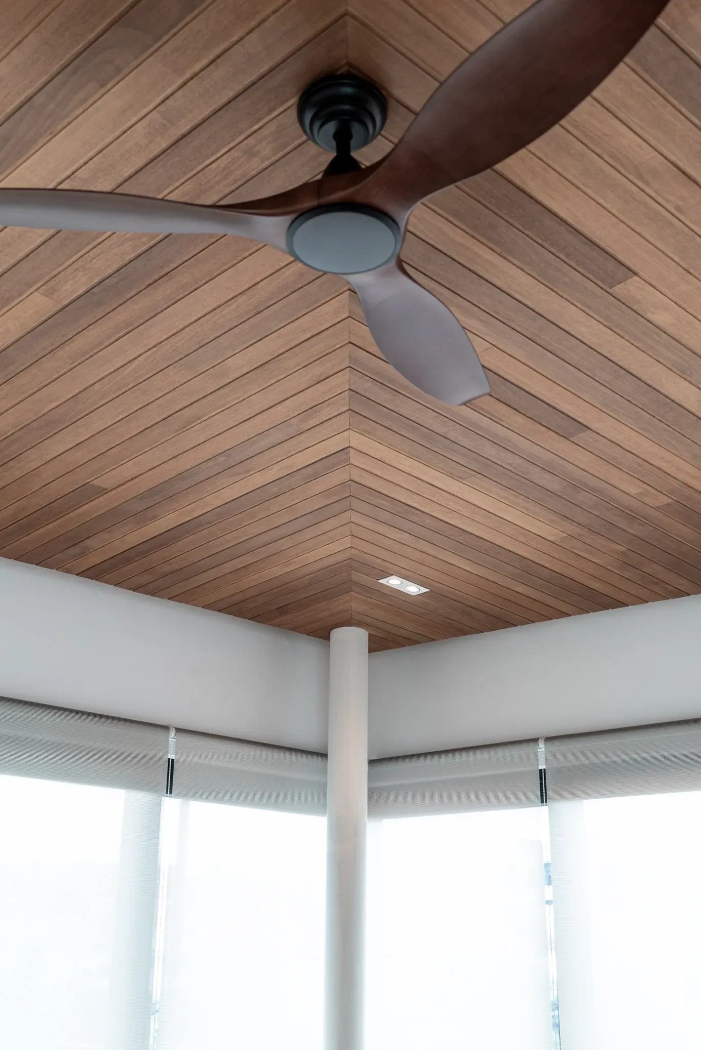 J Concept Designers &mdash; chevron-patterned ceiling with dark ceiling fan