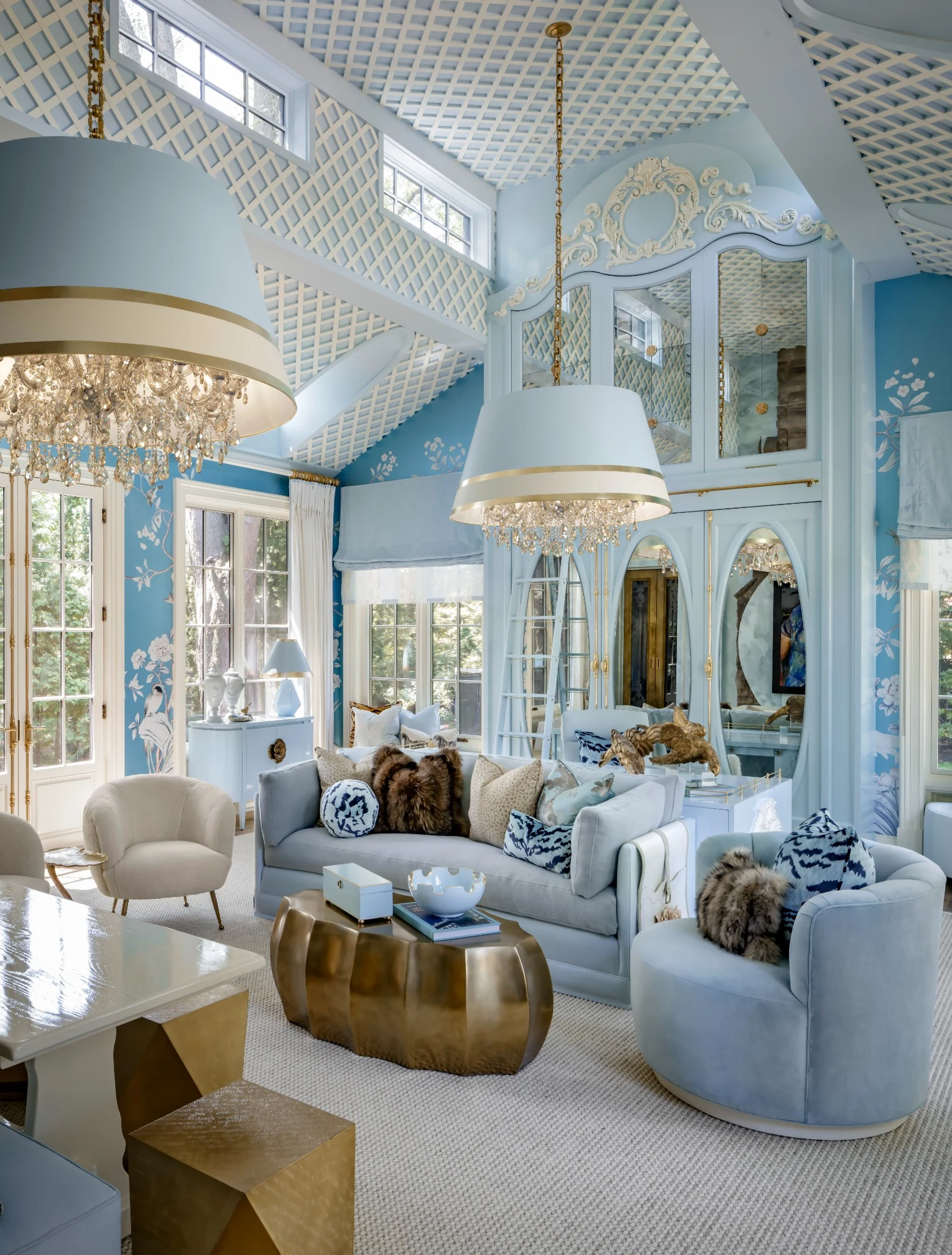 Lori Morris Design &mdash; conservatory lounge with powder blue sofas, brass coffee table and dancing chandelier parties