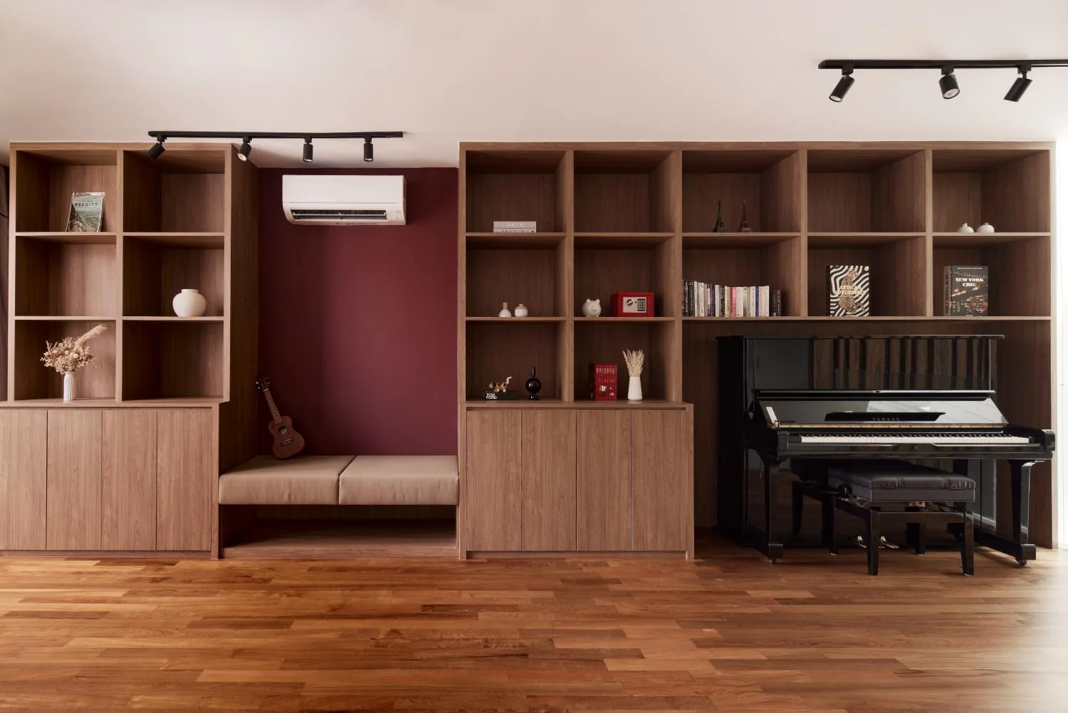 Family room with full-height timber cabinetry, bench and piano