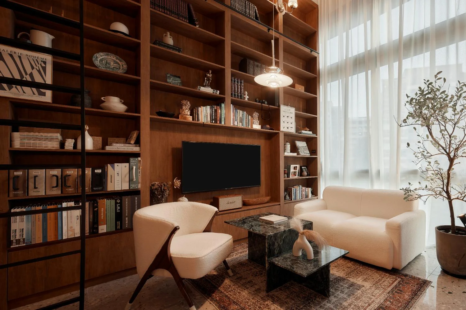 RENOSTUD.IO consultation lounge with timber bookshelf and green marble coffee table